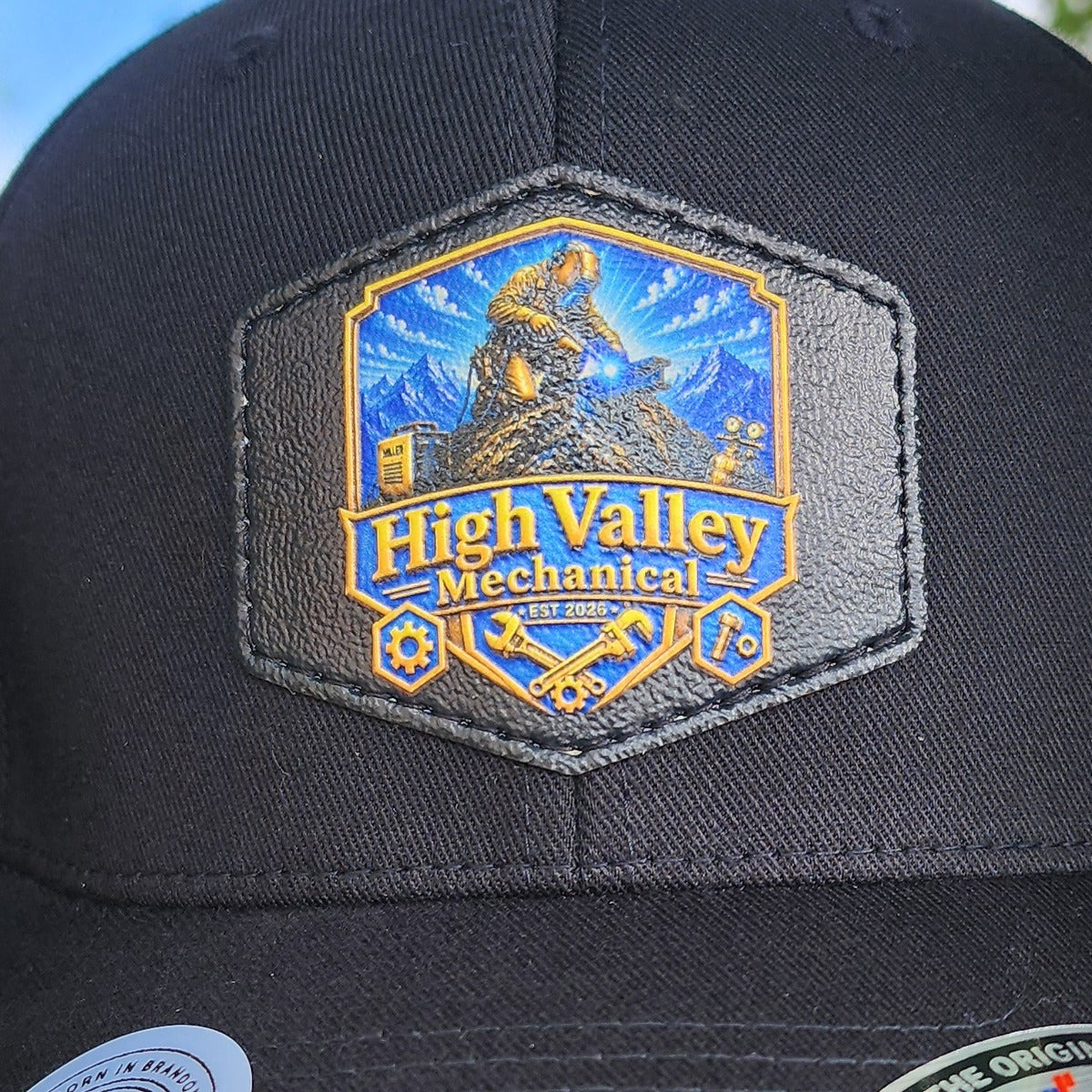 Hexagon 3D resin patch with a full-colour miner and mountain illustration on a black cap