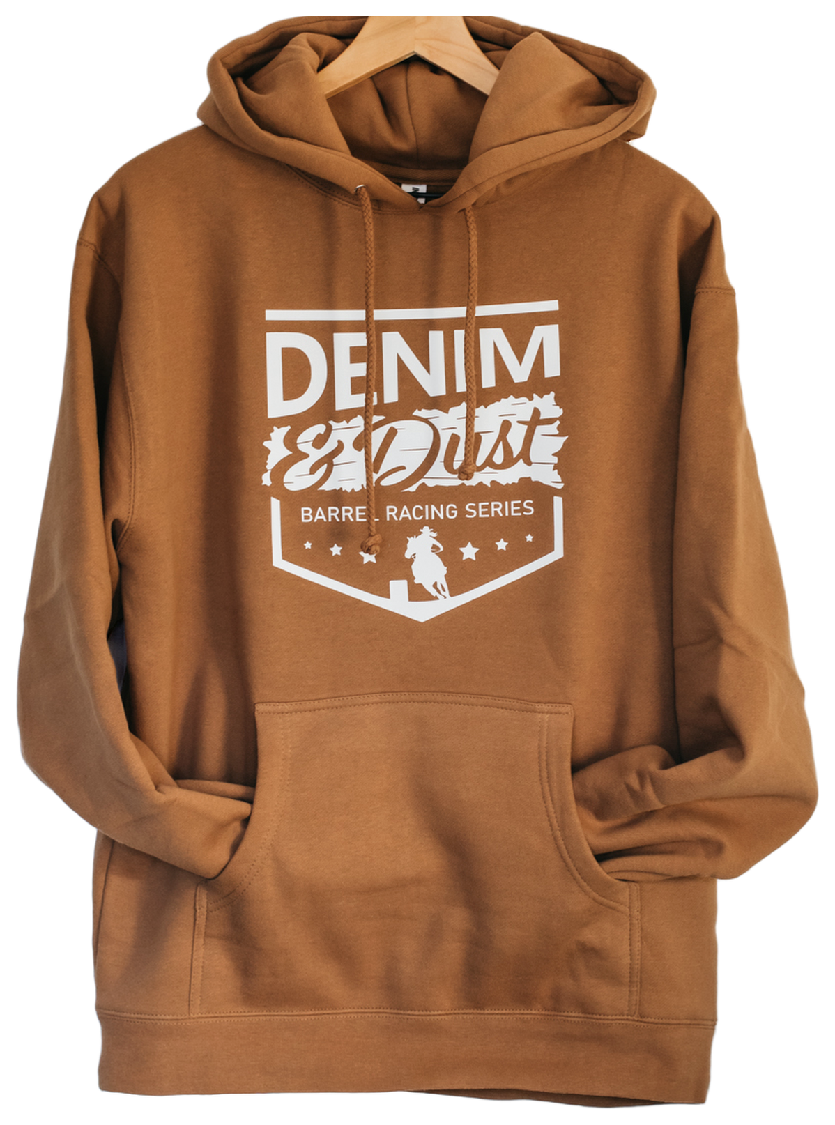 Saddle brown pullover hoodie on a wooden hanger with a white Denim and Dust Barrel Racing Series print, decorated by Leatherwood